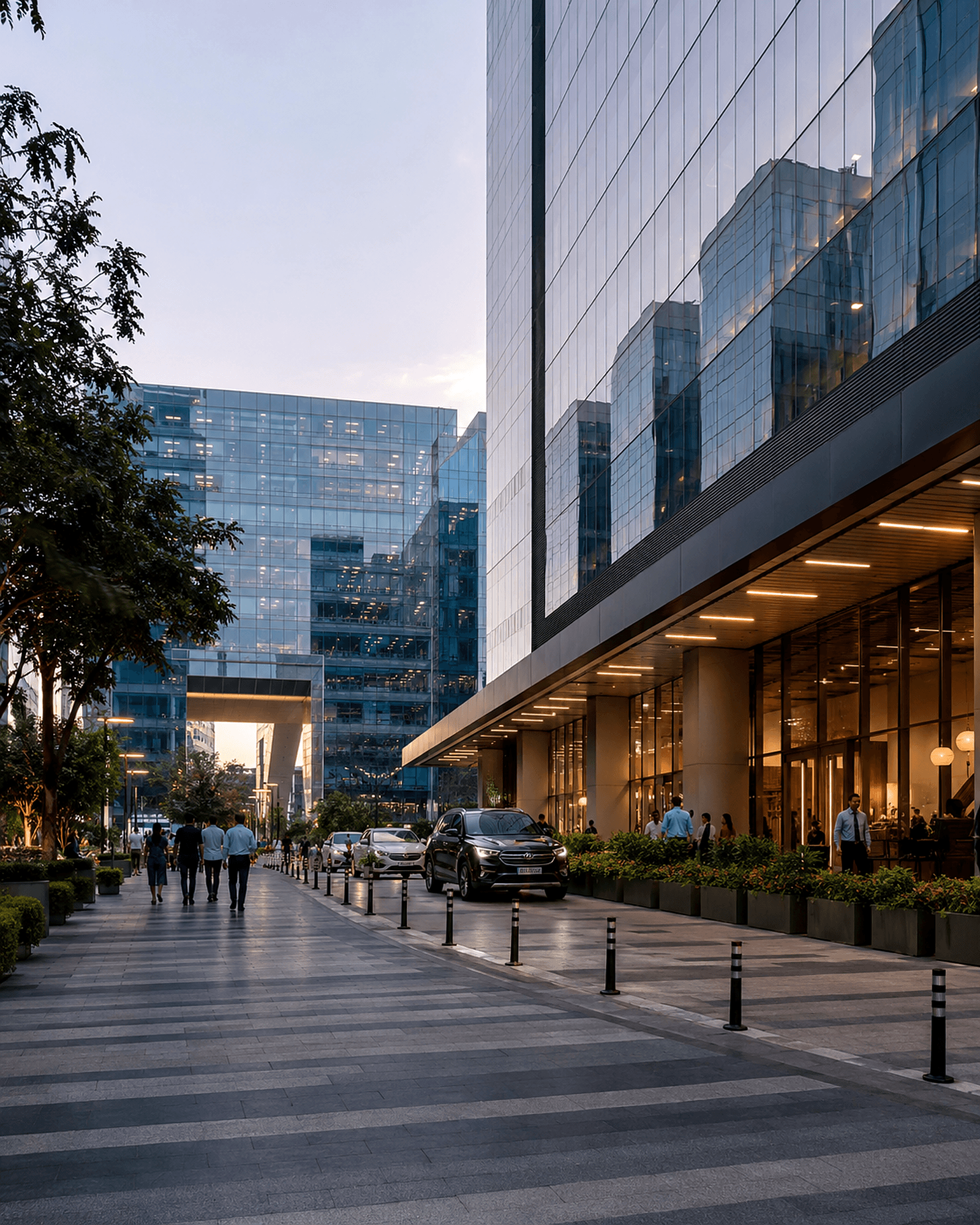 Glass-fronted commercial office building on a city streetscape at dusk — commercial real estate assets.